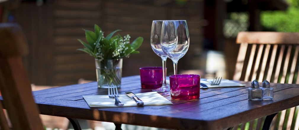Wine glasses on outdoor table setting